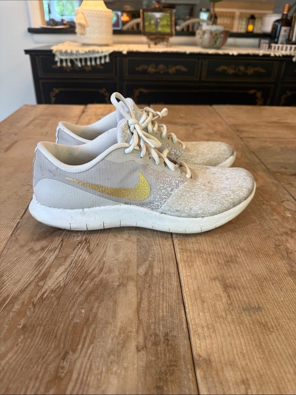 Nike Women's Light Gray Sneakers with Gold Swoosh